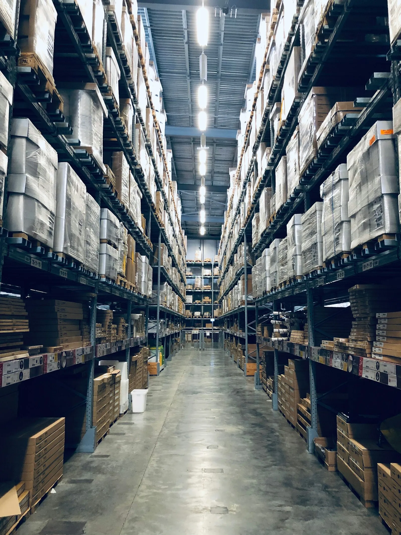 Distribution warehouse stocked with palletised goods